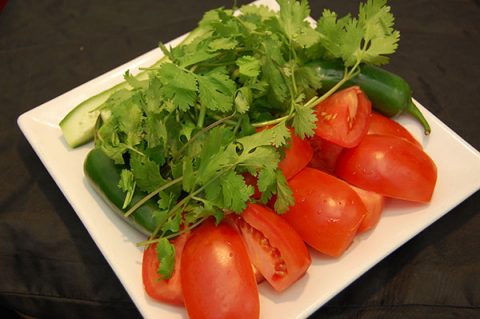 Fresh Vegetables: Tomato, Cucumber, Jalapeño, Green vegetables.